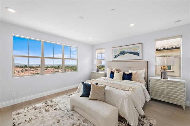 109 Chronology, Irvine, CA 92618 - bedroom featuring baseboards, wood finished floors, and recessed lighting