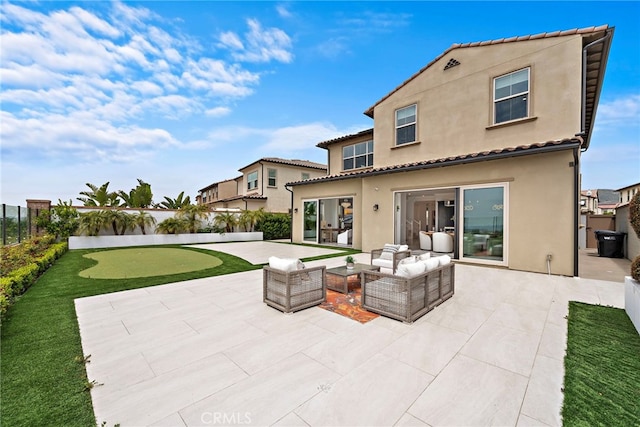 109 Chronology, Irvine, CA 92618 - back of property with a putting green, stucco siding, a patio area, a fenced backyard, and outdoor lounge area