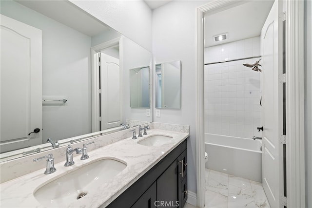 109 Chronology, Irvine, CA 92618 - bathroom with toilet, double vanity, marble finish flooring, and shower / bathtub combination