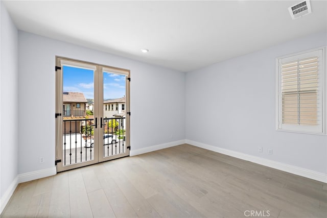 109 Chronology, Irvine, CA 92618 - spare room with wood finished floors, baseboards, french doors, and recessed lighting