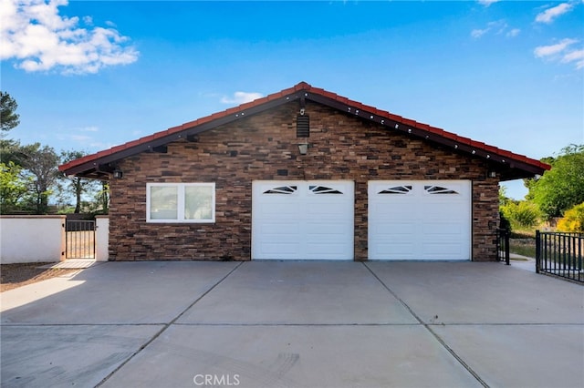 18343 Cocopah Ct, Apple Valley, CA 92307 - exterior space with stone siding, driveway, fence, and a gate
