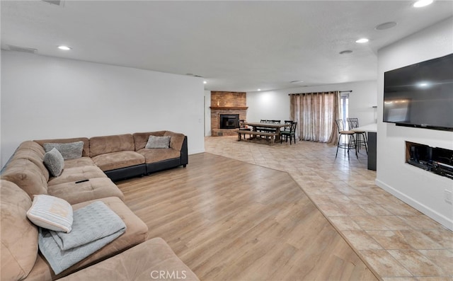 18343 Cocopah Ct, Apple Valley, CA 92307 - living room with wood finished floors, visible vents, a fireplace, and recessed lighting