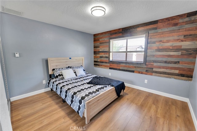 18343 Cocopah Ct, Apple Valley, CA 92307 - bedroom with baseboards, visible vents, and wood finished floors