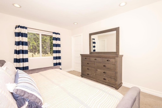 bedroom featuring baseboards, recessed lighting, and carpet