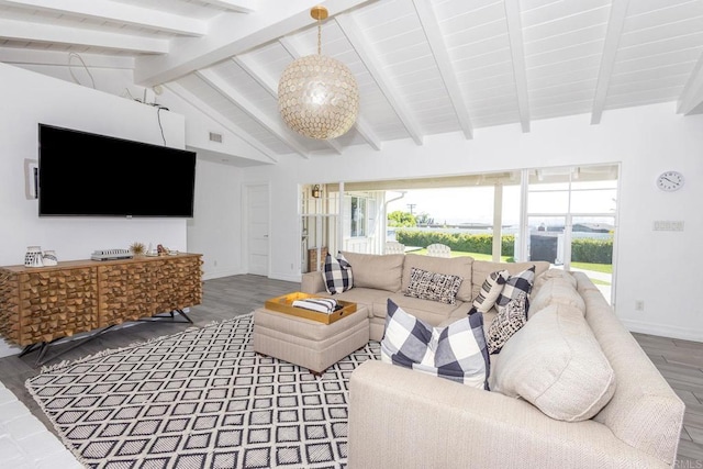 living area with lofted ceiling with beams, baseboards, visible vents, and wood finished floors