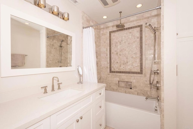 full bath with recessed lighting, vanity, visible vents, and a combined bath / shower with rainfall shower