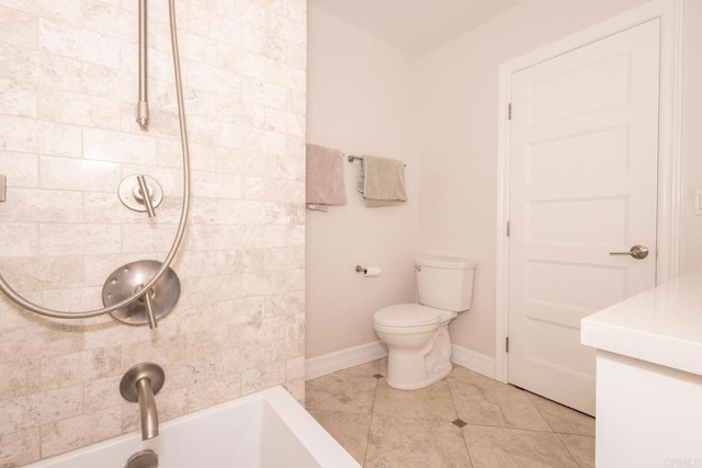bathroom with toilet, baseboards, tile patterned floors, and a sink