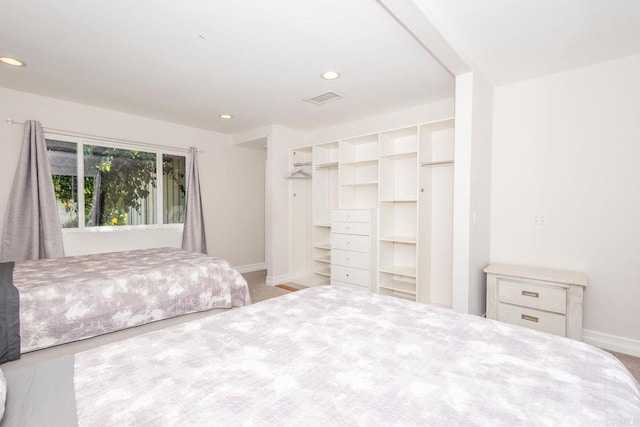 bedroom with light carpet, baseboards, visible vents, and recessed lighting