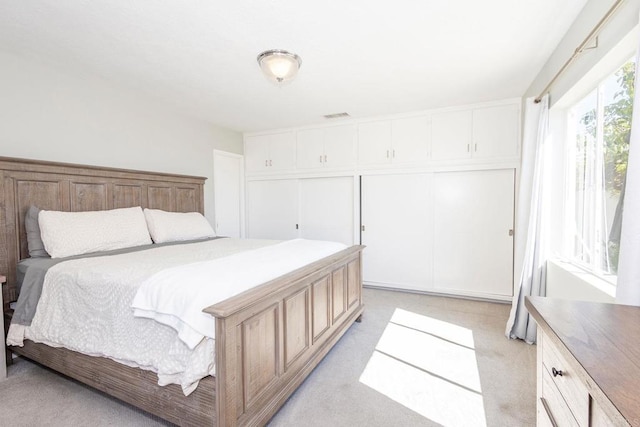 bedroom with light carpet