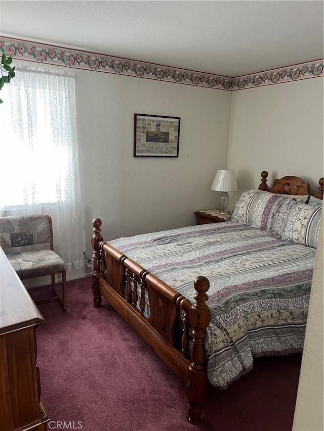 carpeted bedroom with baseboards