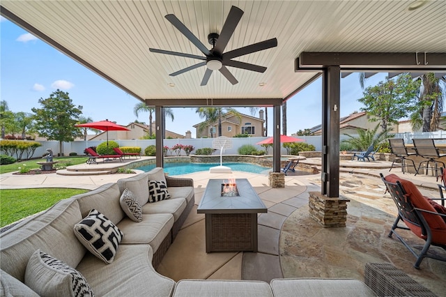 view of patio with an outdoor living space with a fire pit, a fenced backyard, ceiling fan, and a fenced in pool