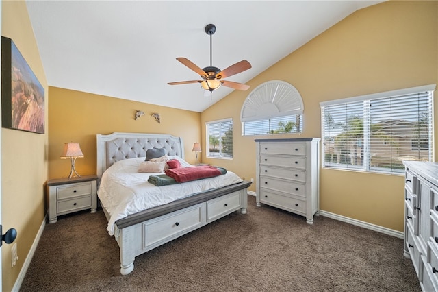 bedroom featuring baseboards, dark carpet, and high vaulted ceiling