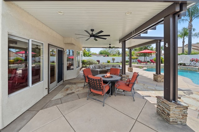 view of patio featuring a fire pit, a ceiling fan, a fenced in pool, and a fenced backyard