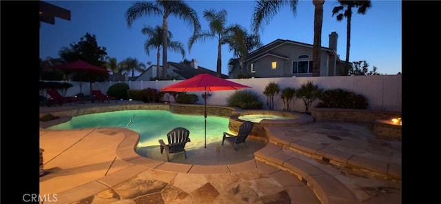 view of pool featuring a fenced backyard, an in ground hot tub, a patio, and a fenced in pool
