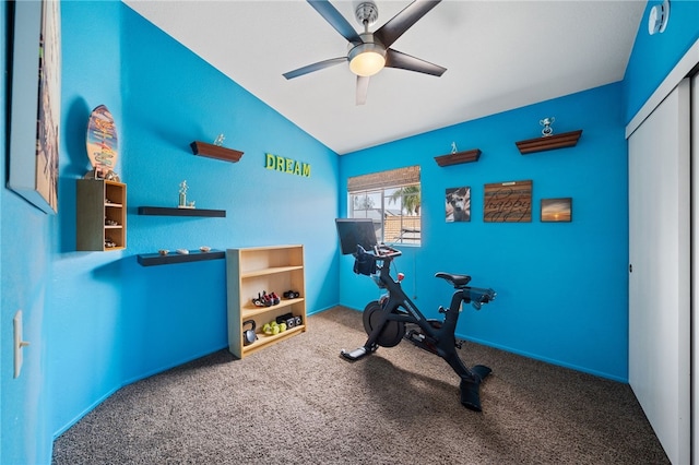 exercise room with vaulted ceiling, ceiling fan, and carpet