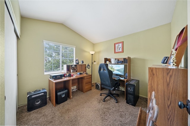 carpeted office featuring lofted ceiling