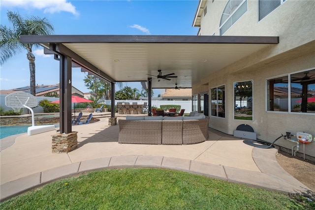 view of patio featuring a ceiling fan, an outdoor pool, outdoor lounge area, and fence