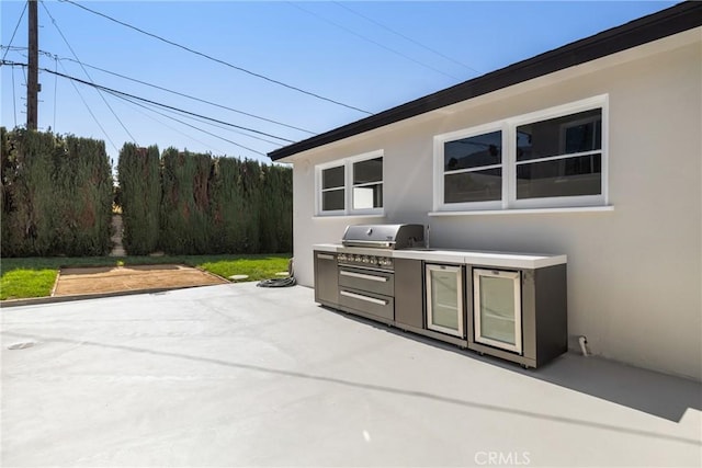 view of patio / terrace with area for grilling and an outdoor kitchen