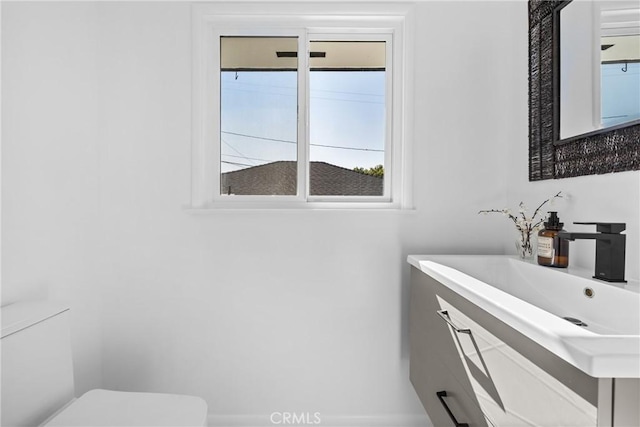 half bathroom with a sink and toilet