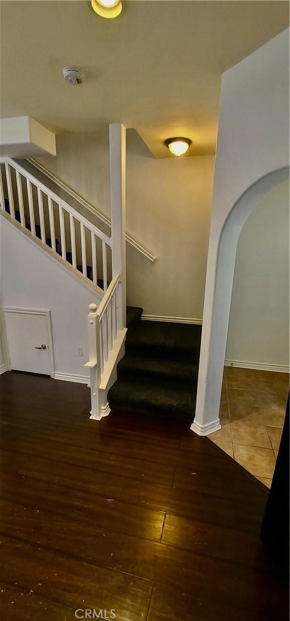 1500 Pine Ave Unit 19, Long Beach, CA 90813 - stairway with arched walkways, wood finished floors, and baseboards