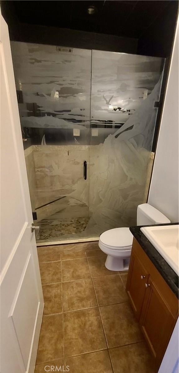 1500 Pine Ave Unit 19, Long Beach, CA 90813 - full bath with vanity, a shower stall, toilet, and tile patterned flooring