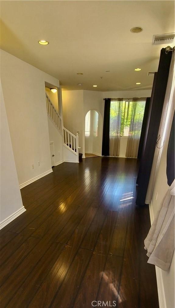 1500 Pine Ave Unit 19, Long Beach, CA 90813 - spare room with wood-type flooring, stairway, baseboards, and recessed lighting