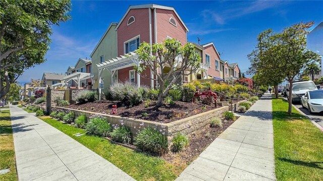 1500 Pine Ave Unit 19, Long Beach, CA 90813 - view of side of home featuring a residential view and a pergola