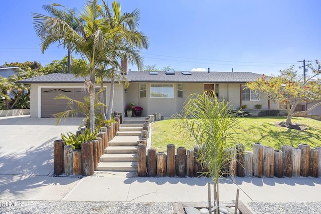 ranch-style house with a garage, stucco siding, fence, a front lawn, and driveway