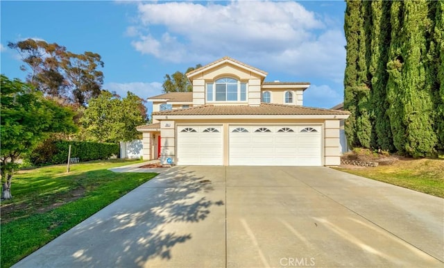 2018 Wren Way, Fullerton, CA 92833 - view of front of property featuring driveway, a garage, stucco siding, a tile roof, and a front yard