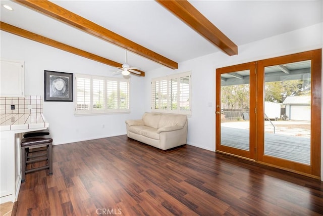 sitting room featuring dark wood-type flooring, lofted ceiling with beams, ceiling fan, and recessed lighting