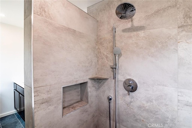room details with a tile shower and vanity