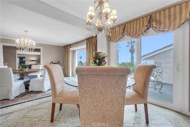 dining room featuring ornamental molding and a notable chandelier