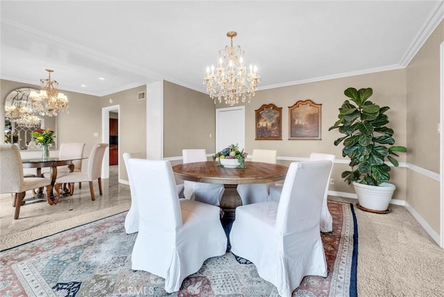 dining area with a chandelier, baseboards, visible vents, and ornamental molding