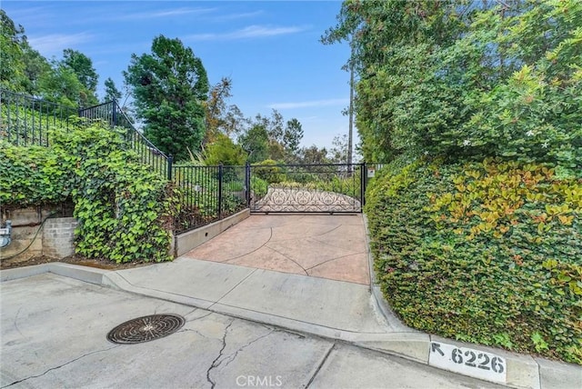 view of gate with fence