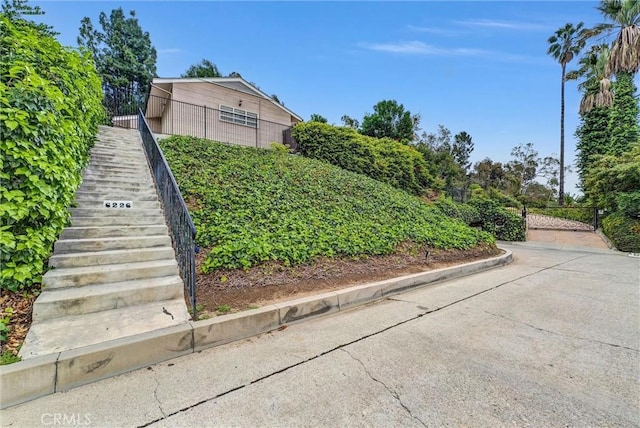 view of side of home with stairway