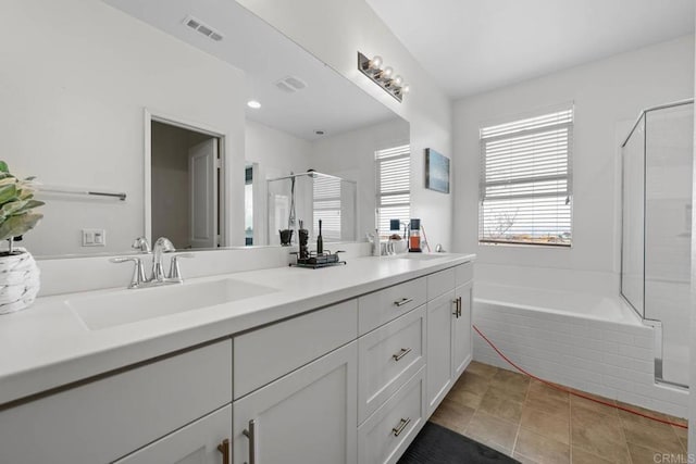 5441 San Roberto, San Diego, CA 92154 - bathroom with double vanity, a garden tub, a stall shower, a sink, and visible vents