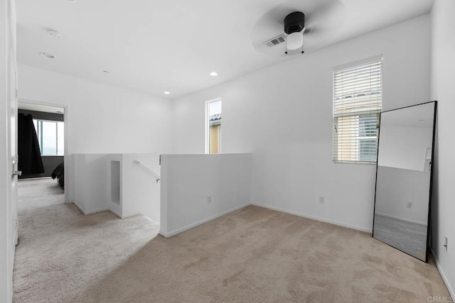5441 San Roberto, San Diego, CA 92154 - empty room with a ceiling fan, a wealth of natural light, and light carpet