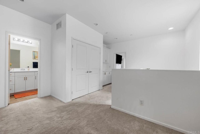 5441 San Roberto, San Diego, CA 92154 - empty room with a sink, visible vents, recessed lighting, light carpet, and baseboards