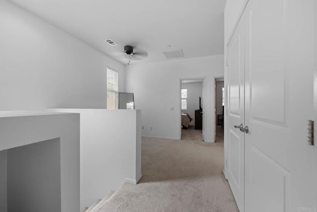 5441 San Roberto, San Diego, CA 92154 - hall with light carpet, visible vents, and plenty of natural light