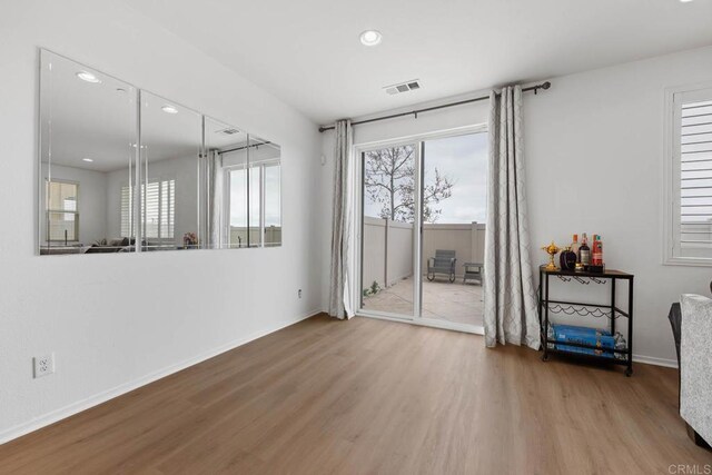 5441 San Roberto, San Diego, CA 92154 - unfurnished room with visible vents, wood finished floors, baseboards, and recessed lighting