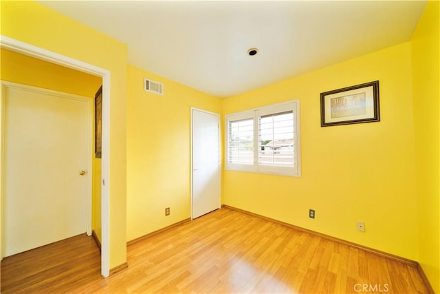 1840 S Summer Pl, West Covina, CA 91792 - unfurnished bedroom featuring light wood finished floors, baseboards, and a closet