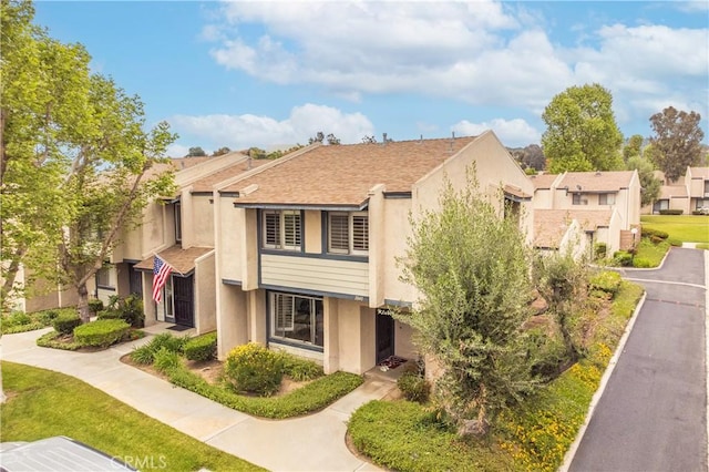 1840 S Summer Pl, West Covina, CA 91792 - view of front facade with stucco siding and a residential view