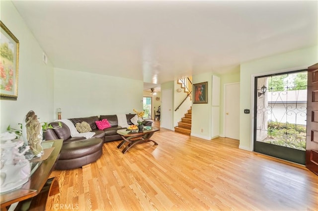 1840 S Summer Pl, West Covina, CA 91792 - living area with stairway, light wood-type flooring, baseboards, and ceiling fan
