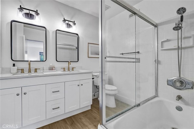 1 Vista Del Ponto, San Clemente, CA 92672 - bathroom with double vanity, toilet, wood finished floors, and a sink