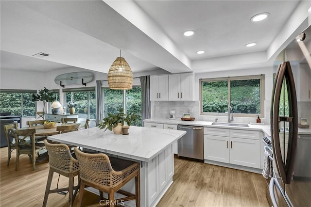 1 Vista Del Ponto, San Clemente, CA 92672 - kitchen featuring freestanding refrigerator, a wealth of natural light, a sink, and dishwasher