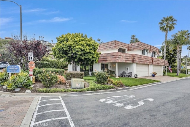 1 Vista Del Ponto Unit 83, San Clemente, CA 92672 - view of property featuring an attached garage