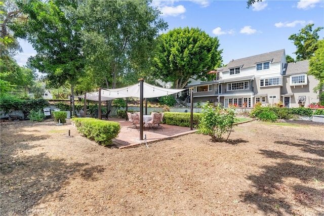 rear view of property with a patio area