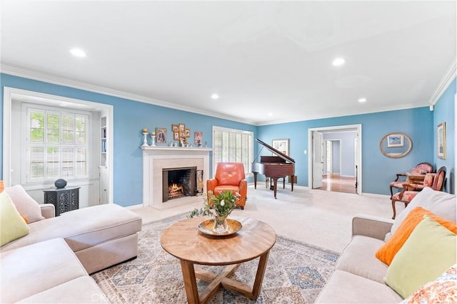 carpeted living room with crown molding, baseboards, a high end fireplace, and recessed lighting