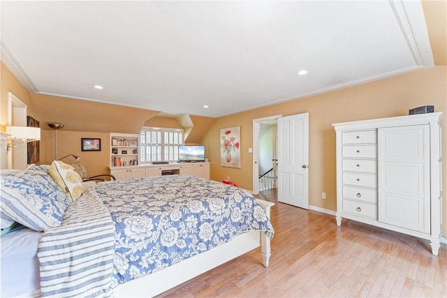 bedroom with light wood finished floors, ornamental molding, and recessed lighting