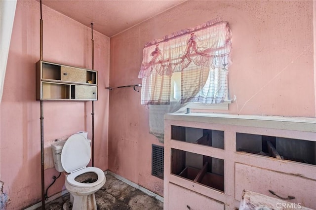 bathroom featuring toilet and visible vents